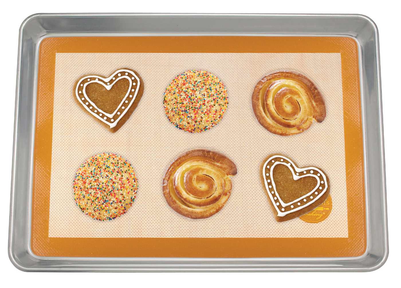 Decorated cookies on a silicone baking mat on a sheet pan