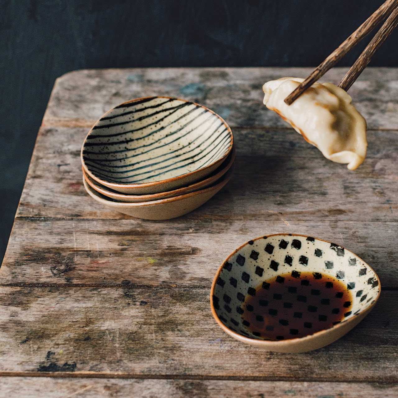 The Danica Heirloom Unite Element pinch bowls with soy sauce