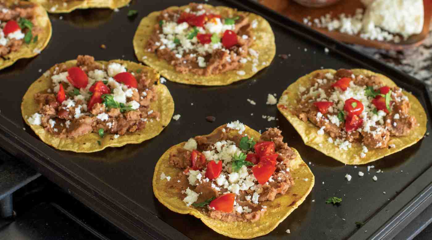 Tostadas cooking on a Nordic Ware reversible griddle