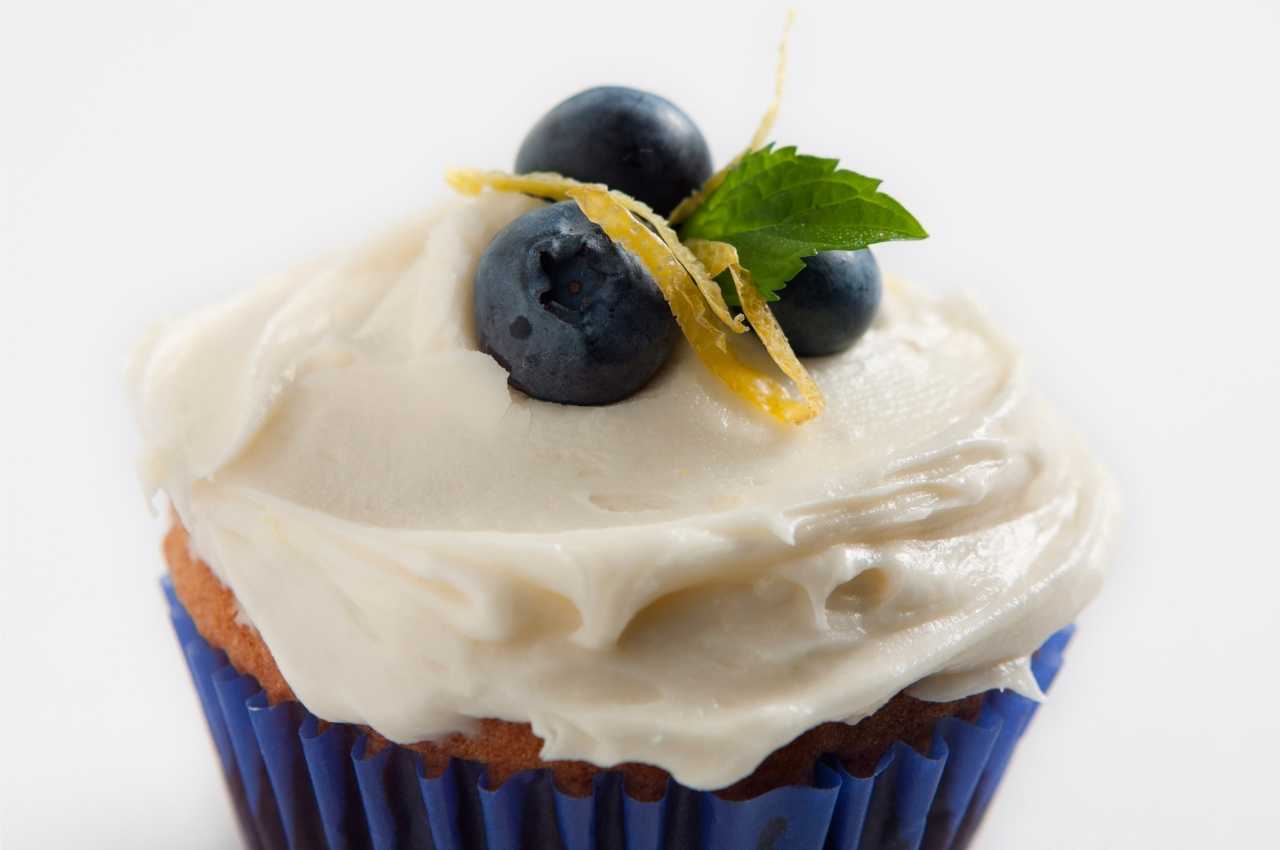 A cupcake iced with an offset spatula