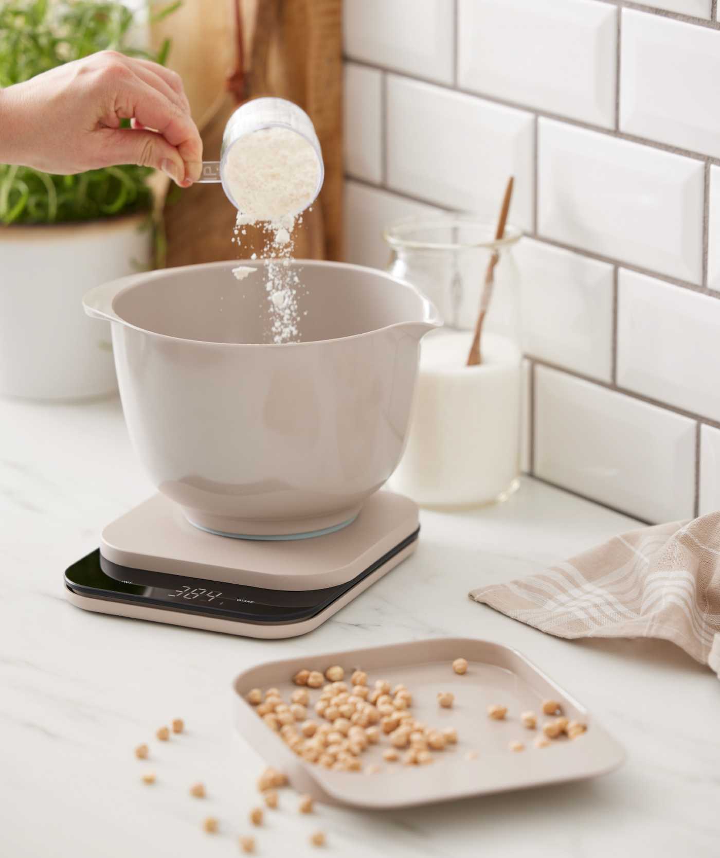 The Rosti Mensura digital kitchen scale in use