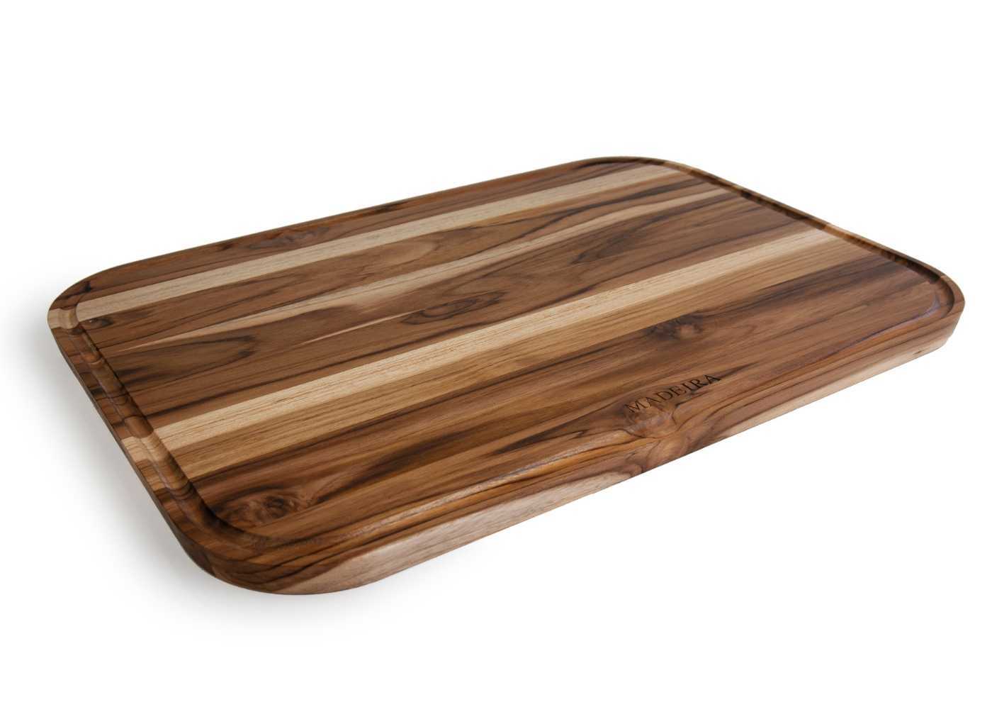 A teak cutting board with golden and darker brown variations in color