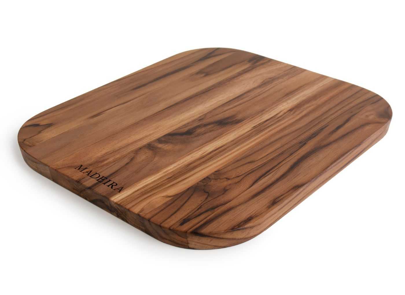 A teak cutting board without a juice groove.